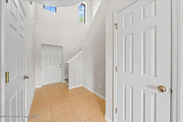 a view of a hallway with a white door