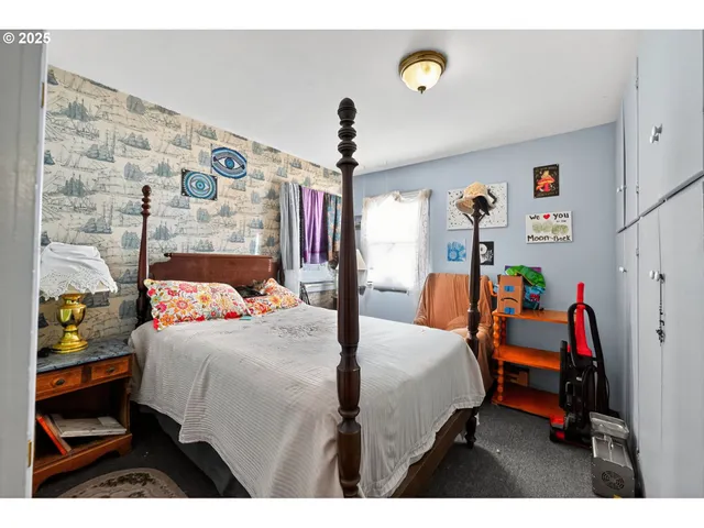 a bedroom with a bed and a table