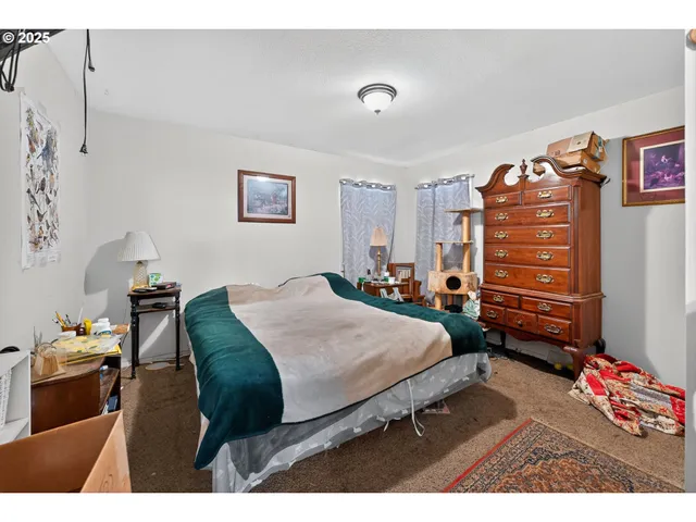 a bedroom with furniture and cabinets