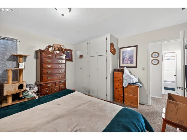 a bed room with a bed and a flat screen tv