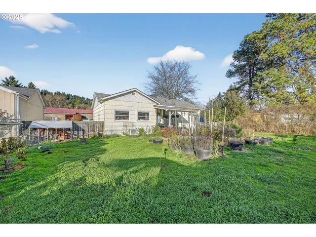 a swimming pool with outdoor seating and yard