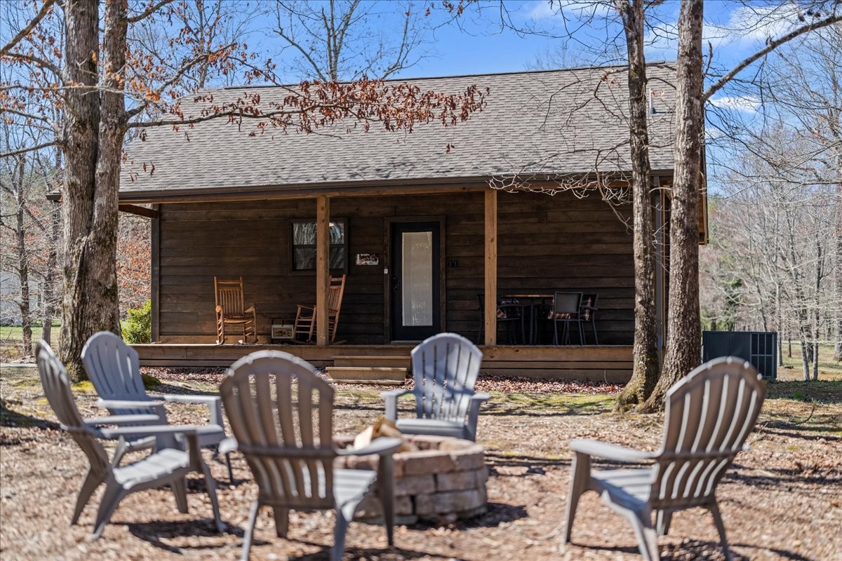 450 Flat Branch Road Tracy City, TN 37387 - Photo 20 of 57 a view of a patio with a table and chairs