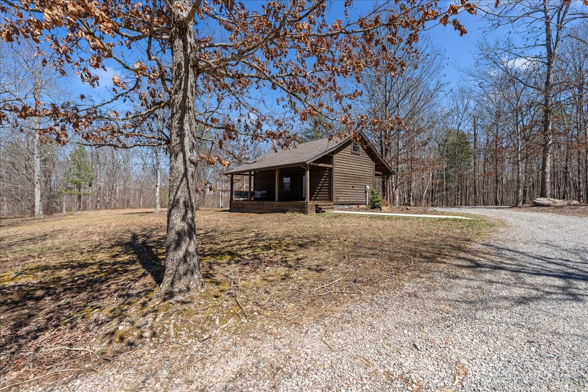 450 Flat Branch Road Tracy City, TN 37387 - Photo 23 of 57 a front view of a house with a yard