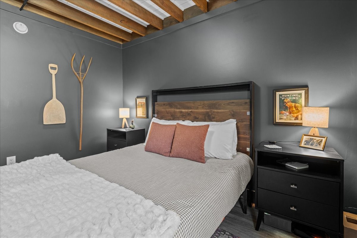 450 Flat Branch Road Tracy City, TN 37387 - Photo 39 of 57 a bedroom with a bed and a lamp