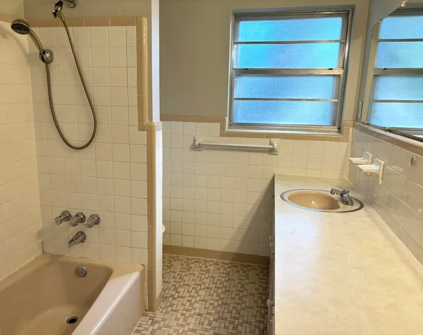 a bathroom with a sink and a shower