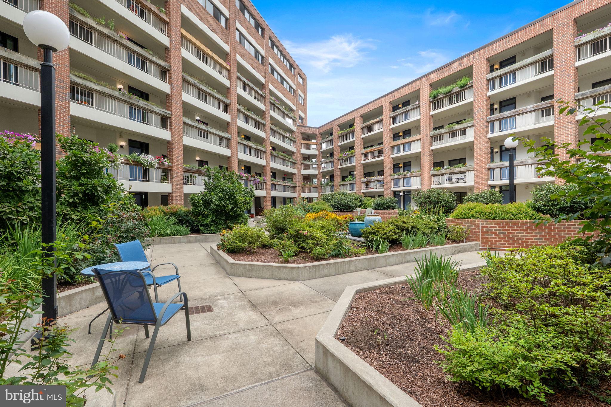 1951 Sagewood Lane, Unit 315 Reston, VA 20191 - Photo 21 of 37 a view of a building and garden