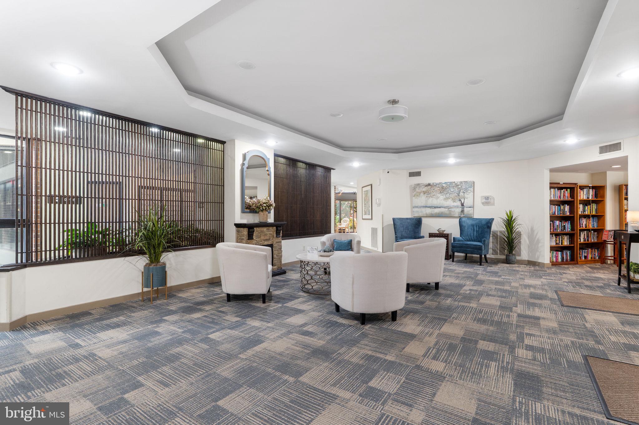 1951 Sagewood Lane, Unit 315 Reston, VA 20191 - Photo 24 of 37 a living room with furniture and a large window