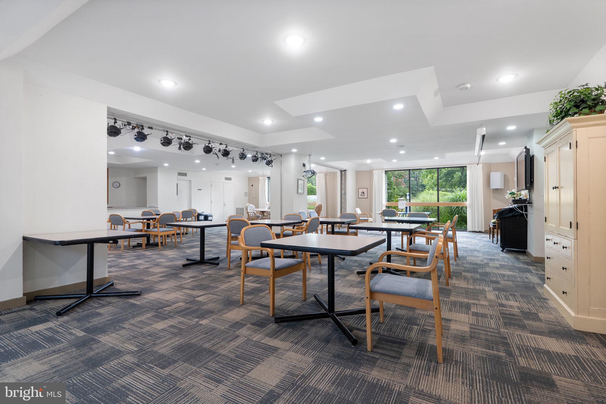 1951 Sagewood Lane, Unit 315 Reston, VA 20191 - Photo 26 of 37 a room with lots of chairs and a table