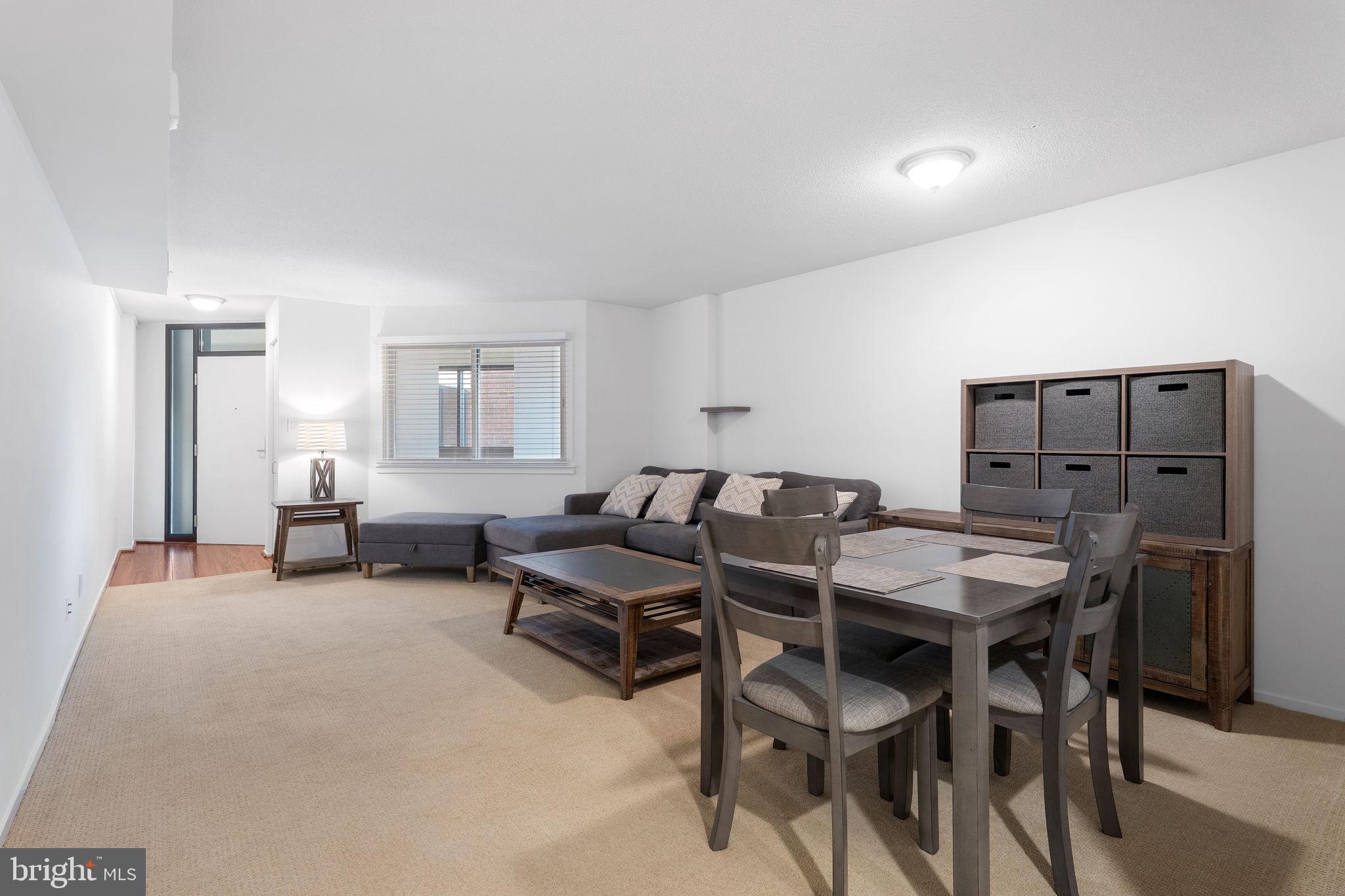 1951 Sagewood Lane, Unit 315 Reston, VA 20191 - Photo 6 of 37 a livingroom with furniture and wooden floor