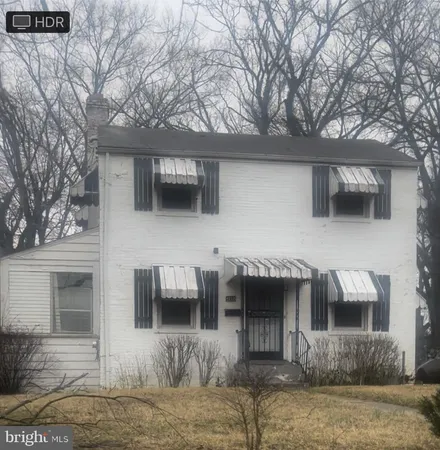 a front view of a house with garage