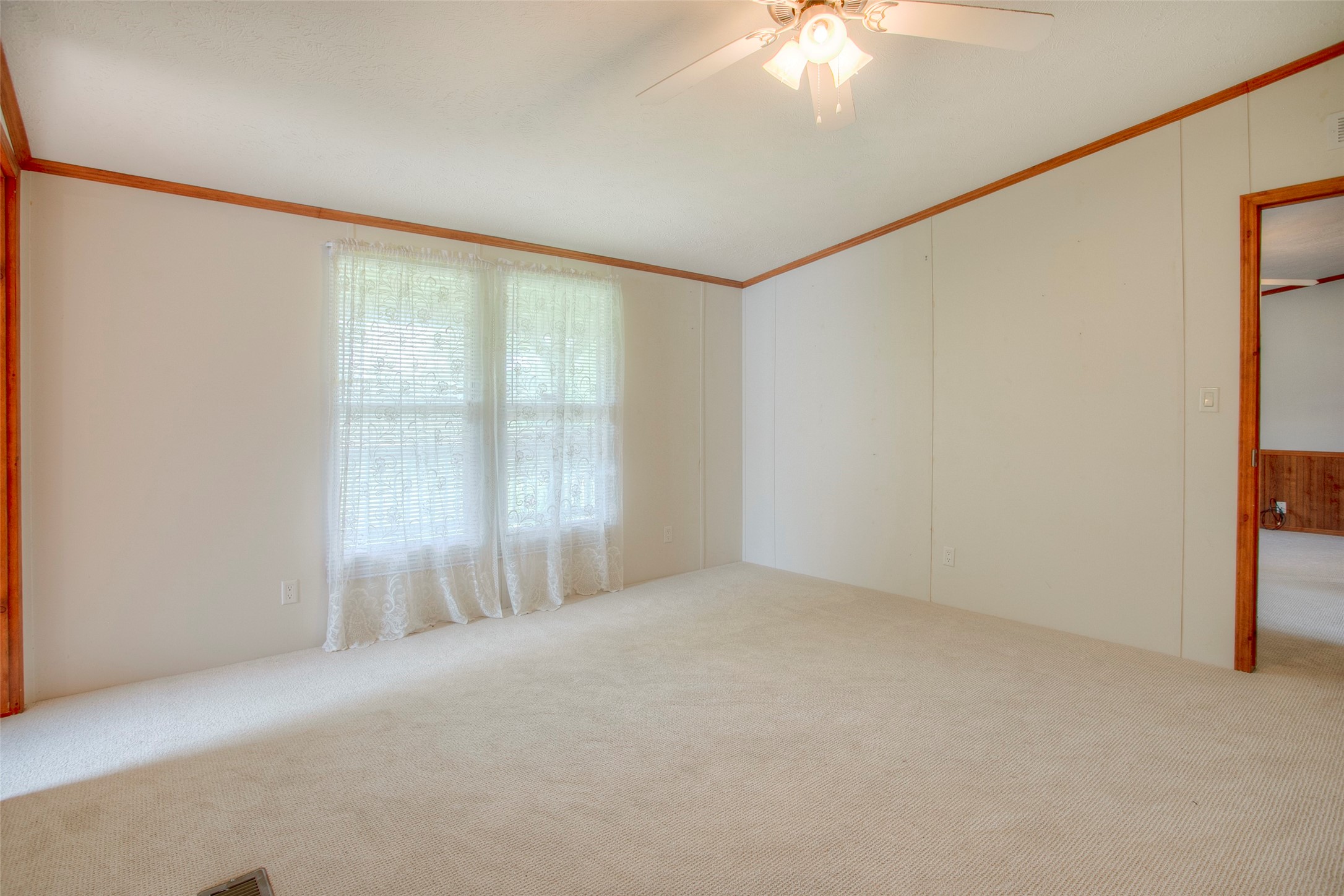 176 Low Keels Road Trinity, TX 75862 - Photo 19 of 46 a view of an empty room with a window