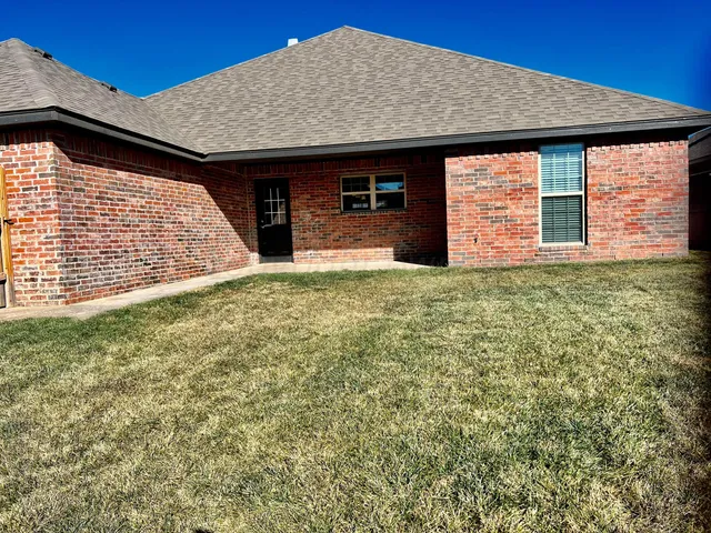 a front view of a house with yard
