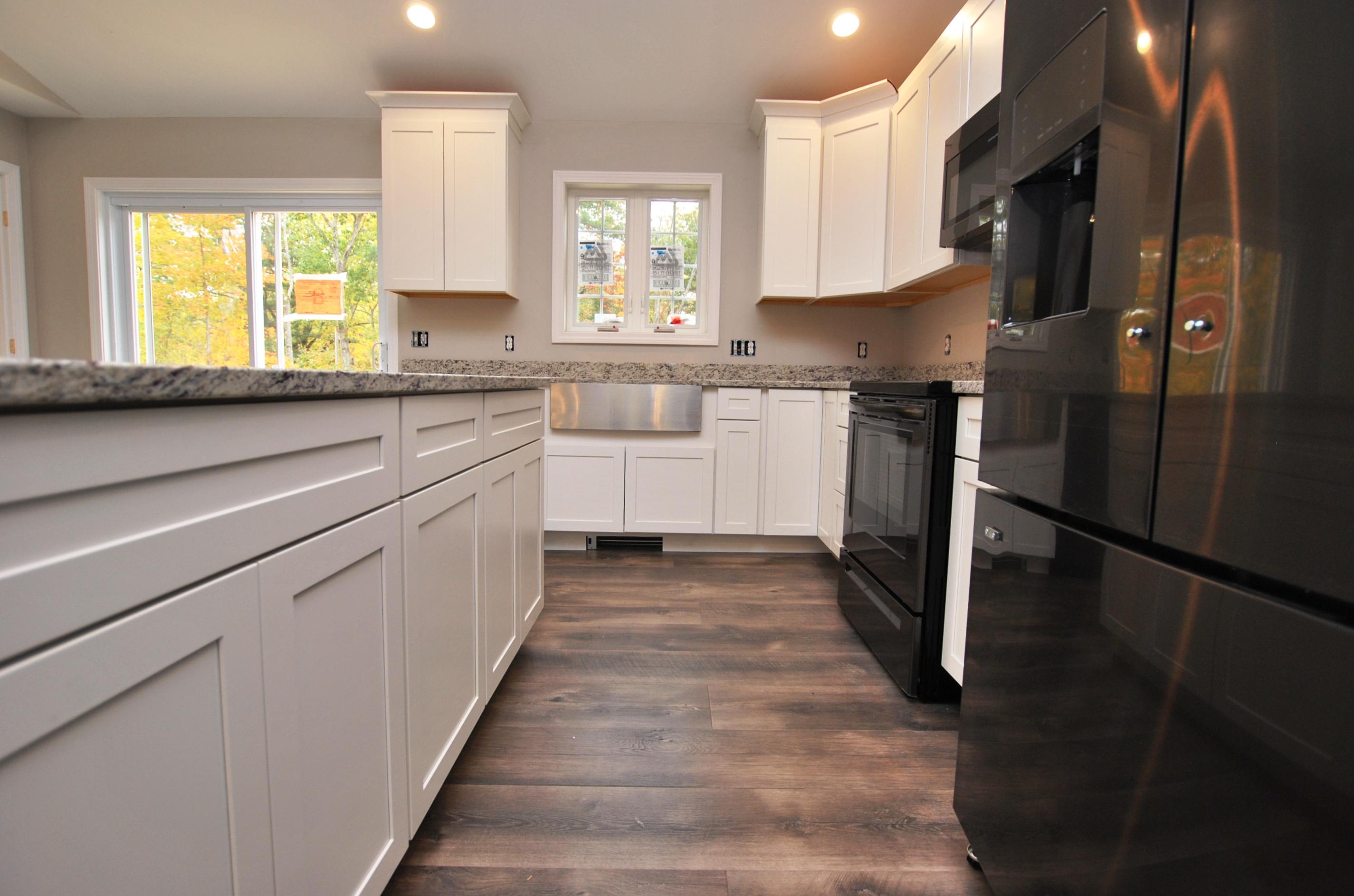 209 Ossipee Hill Road East Waterboro, ME 04030 - Photo 10 of 23 Black stainless steel appliances.