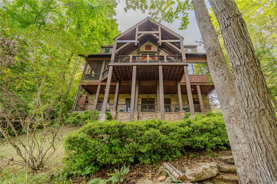 102 State Rd S-39-143 Sunset, SC 29685 - Photo 4 of 47 This magnificent multi-level residence features expansive balconies, offering seamless indoor-outdoor living.