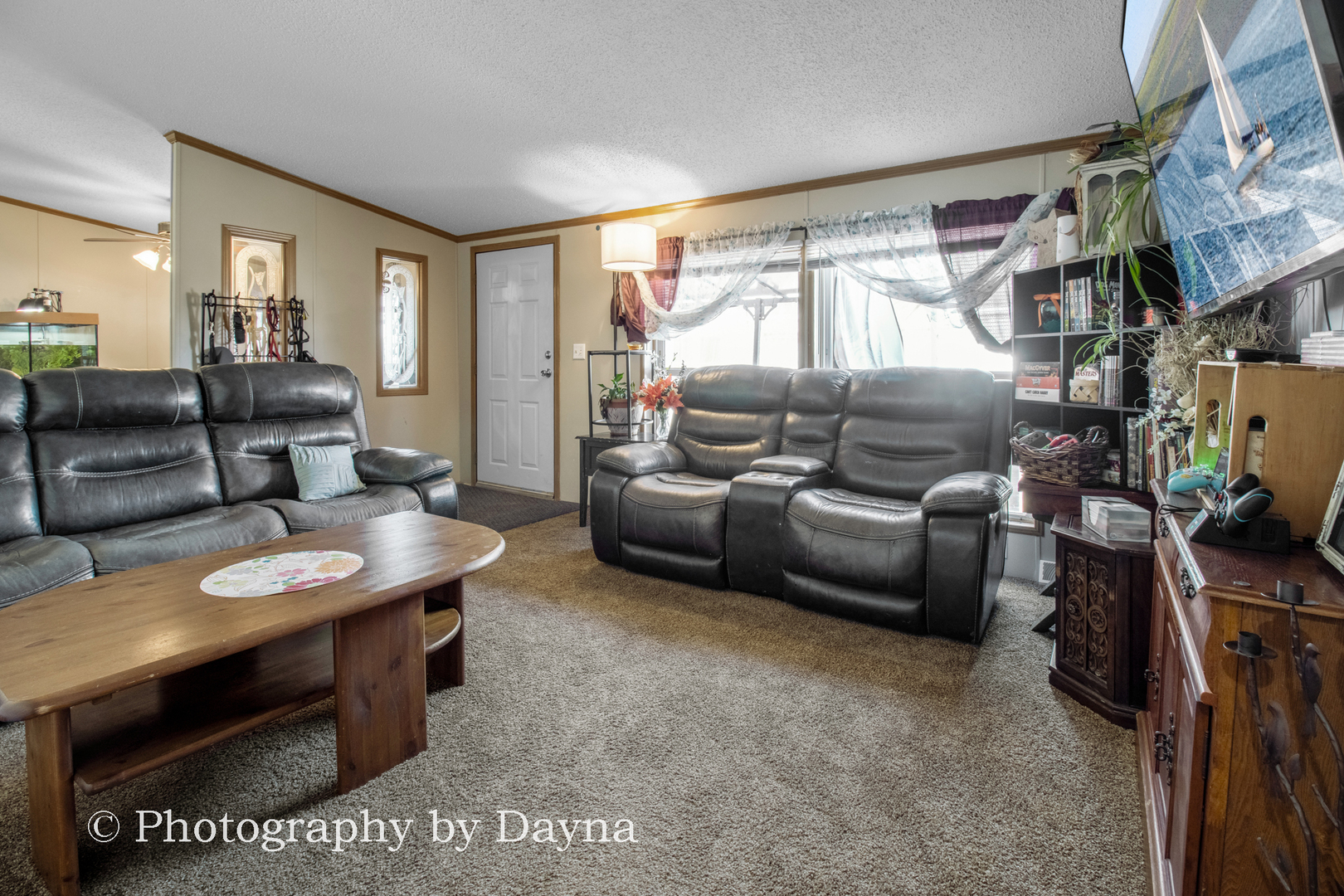 85 St Michaels Drive Bourbonnais, IL 60914 - Photo 3 of 14 a living room with furniture and a flat screen tv