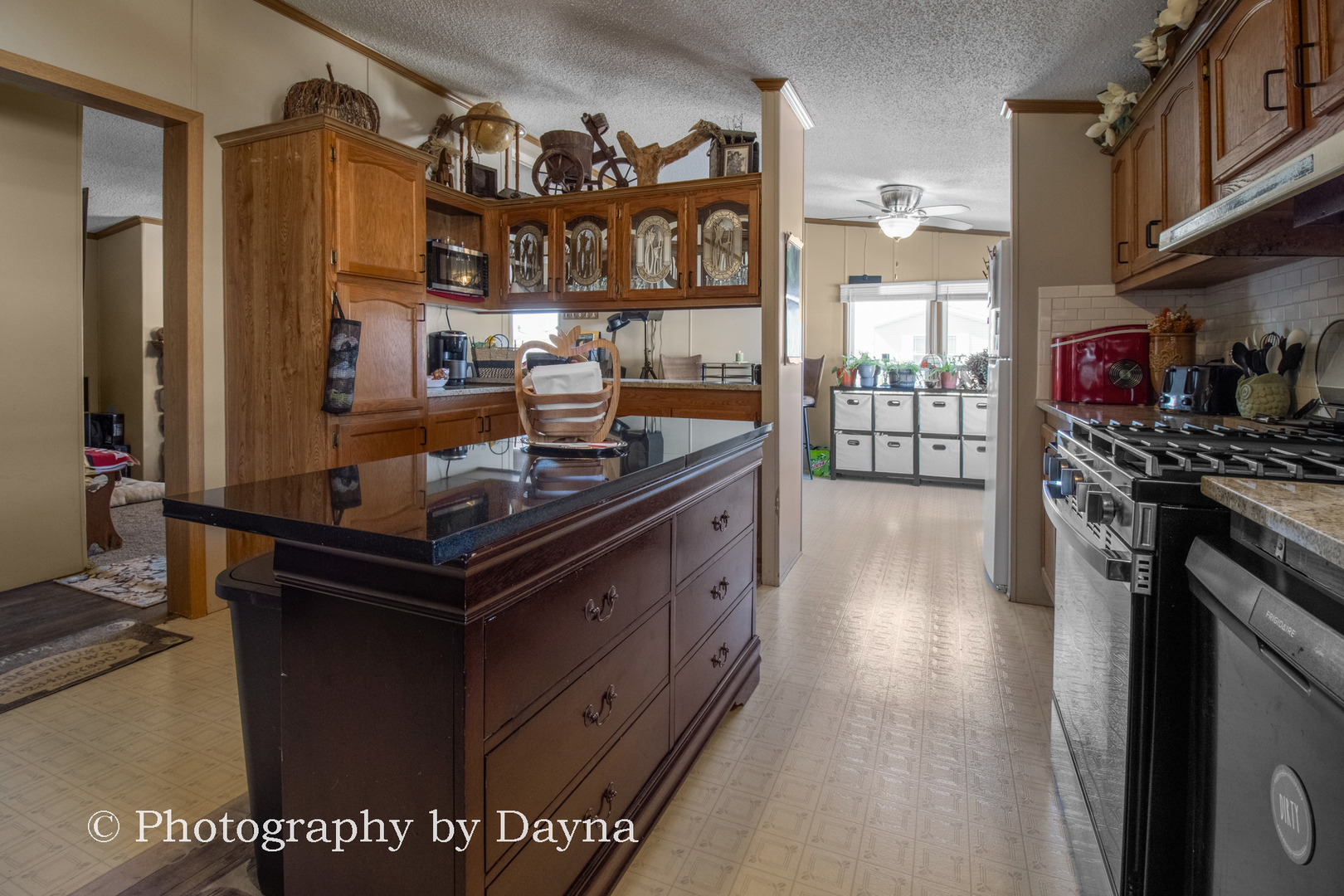 85 St Michaels Drive Bourbonnais, IL 60914 - Photo 8 of 14 a kitchen with stainless steel appliances granite countertop a stove and a sink