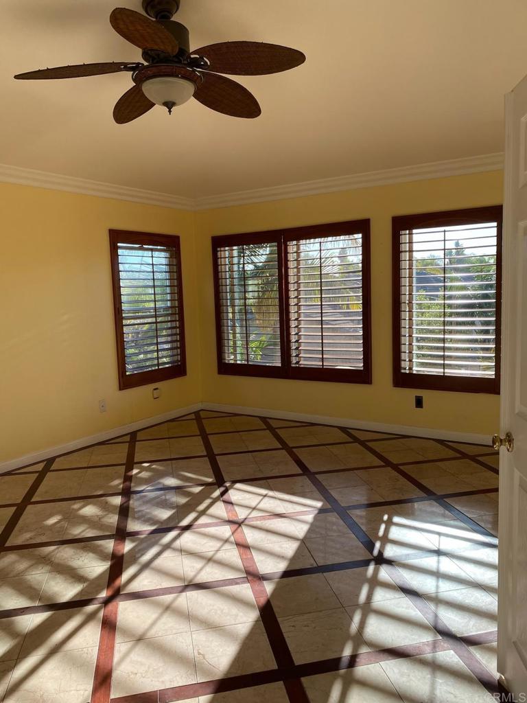 1018 Burga Loop Chula Vista, CA 91910 - Photo 13 of 17 a bedroom with a bed and two windows
