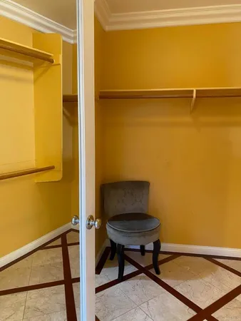 a bath tub sitting in a bathroom next to a window