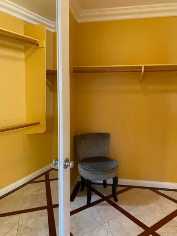 a bath tub sitting in a bathroom next to a window