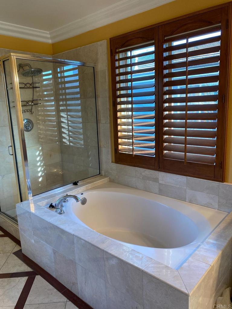 1018 Burga Loop Chula Vista, CA 91910 - Photo 10 of 17 a bath tub sitting in a bathroom next to a window