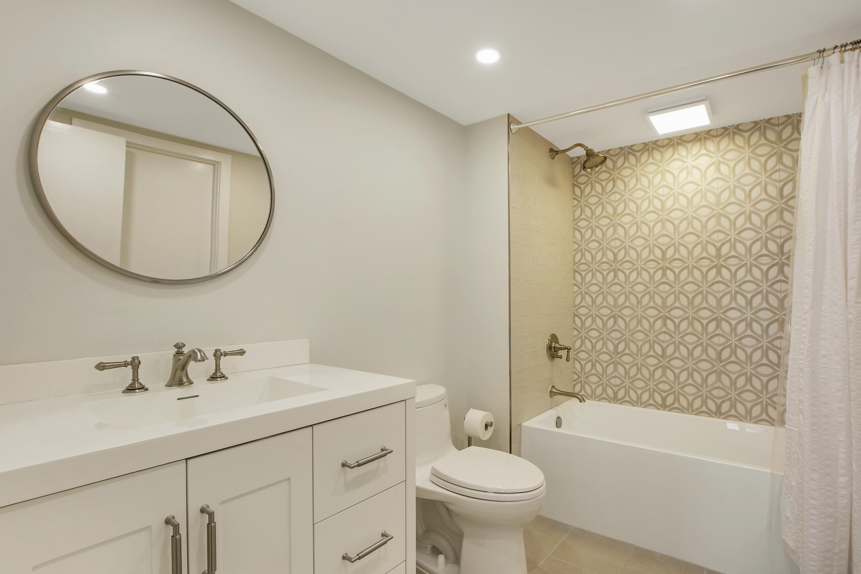 500 Ocean Drive, Unit E9A Juno Beach, FL 33408 - Photo 11 of 21 a bathroom with a sink toilet and shower