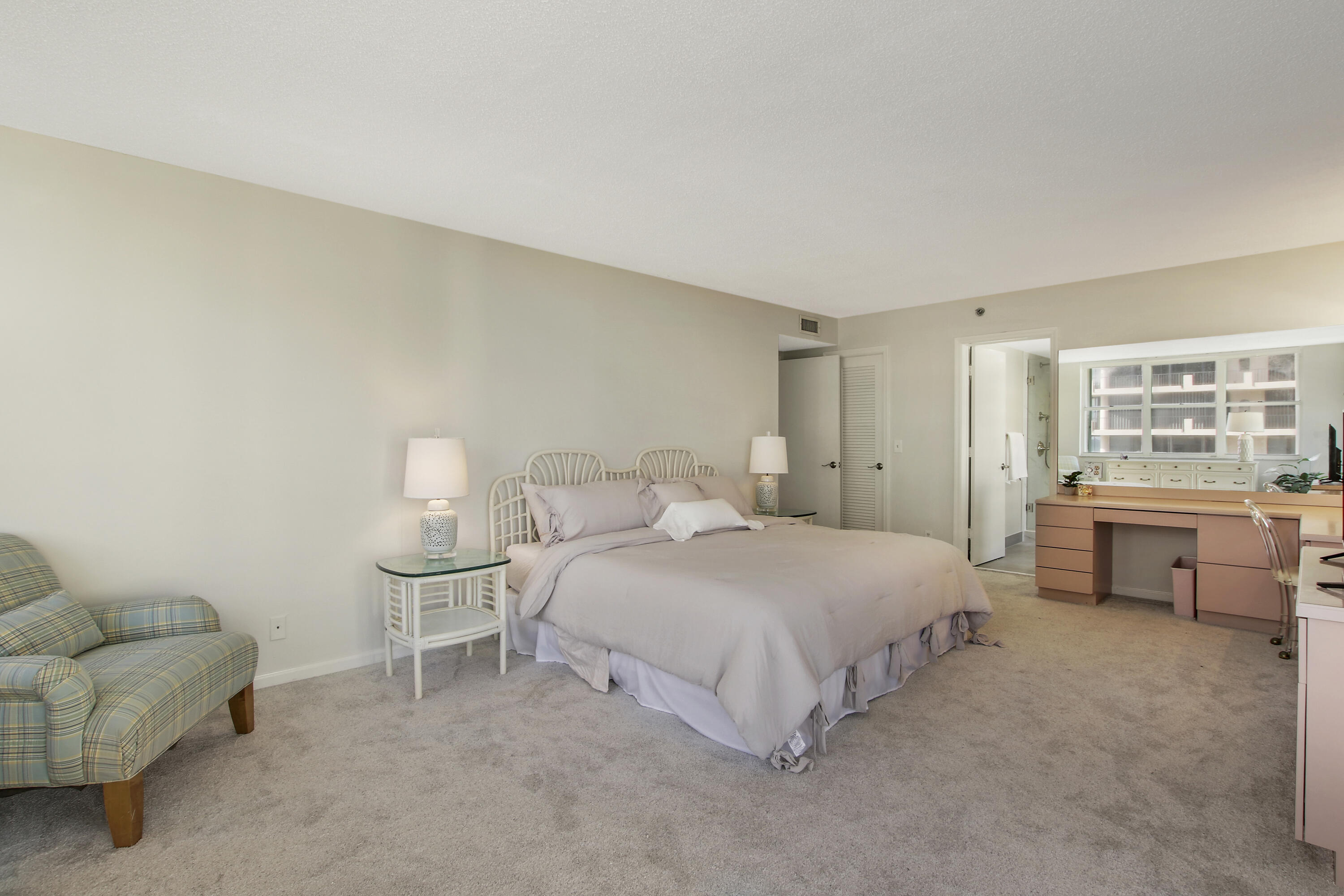 500 Ocean Drive, Unit E9A Juno Beach, FL 33408 - Photo 7 of 21 a bedroom with a bed and a couch