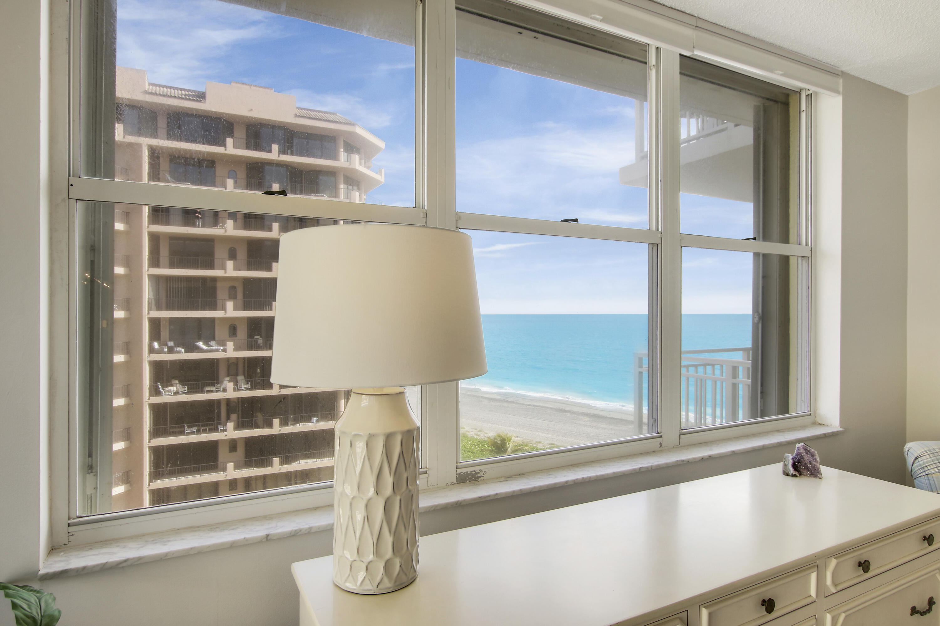 500 Ocean Drive, Unit E9A Juno Beach, FL 33408 - Photo 8 of 21 a view of staircase with a window