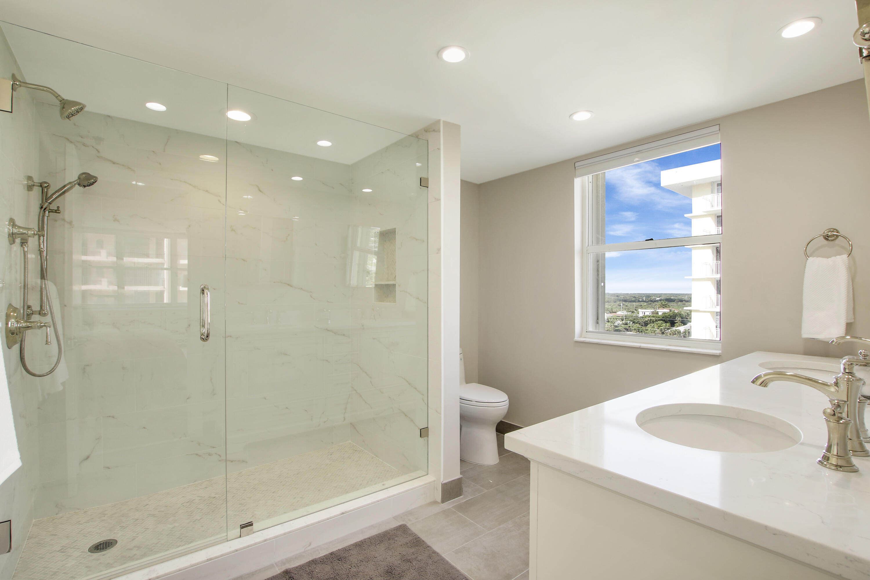 500 Ocean Drive, Unit E9A Juno Beach, FL 33408 - Photo 9 of 21 a bathroom with a sink toilet and shower
