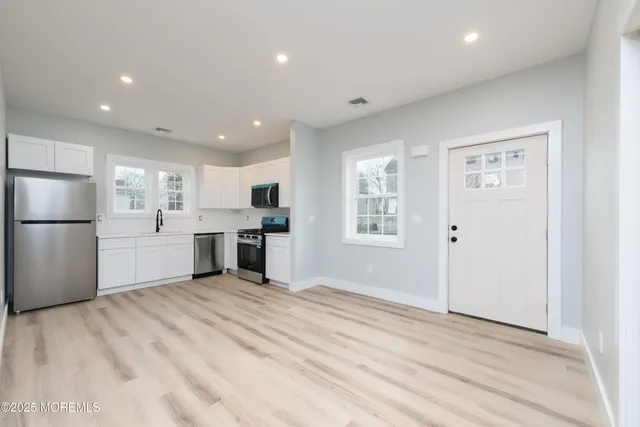 a view of kitchen with wooden floor