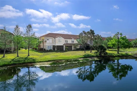a view of a lake with a house in the background