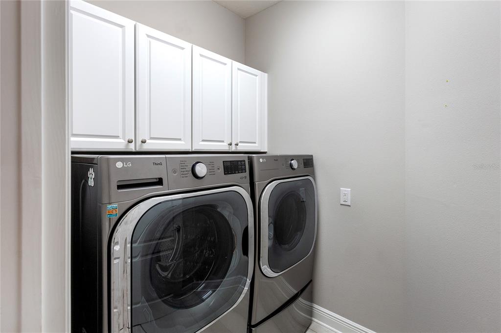 8142 Miramar Way Lakewood Ranch, FL 34202 - Photo 21 of 45 a utility room with dryer and washer