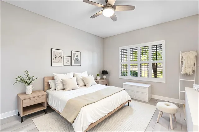 a bedroom with a large bed and a window