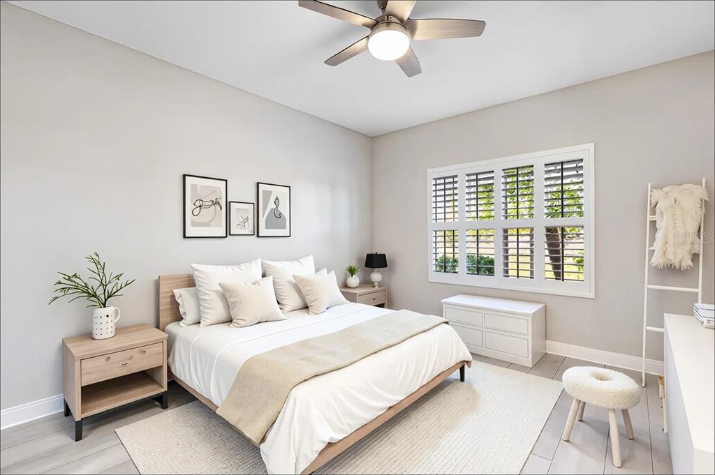 8142 Miramar Way Lakewood Ranch, FL 34202 - Photo 28 of 45 a bedroom with a large bed and a window