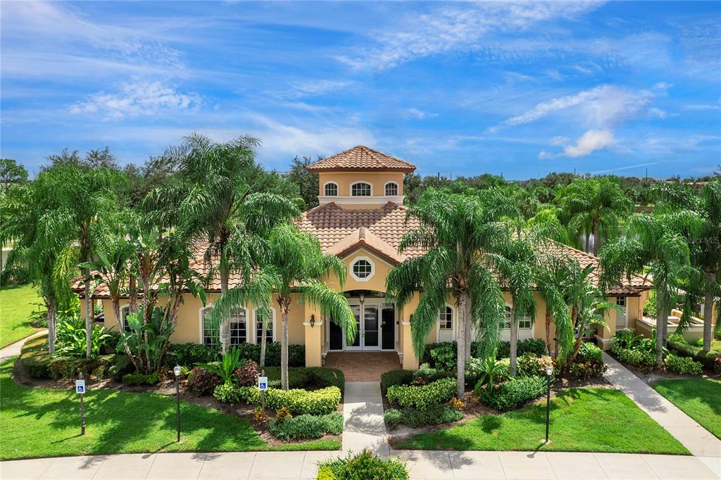 8142 Miramar Way Lakewood Ranch, FL 34202 - Photo 31 of 45 a front view of a house with garden