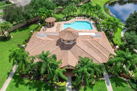 a view of a yard with plants and pool