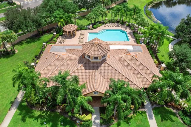 a view of a yard with plants and pool