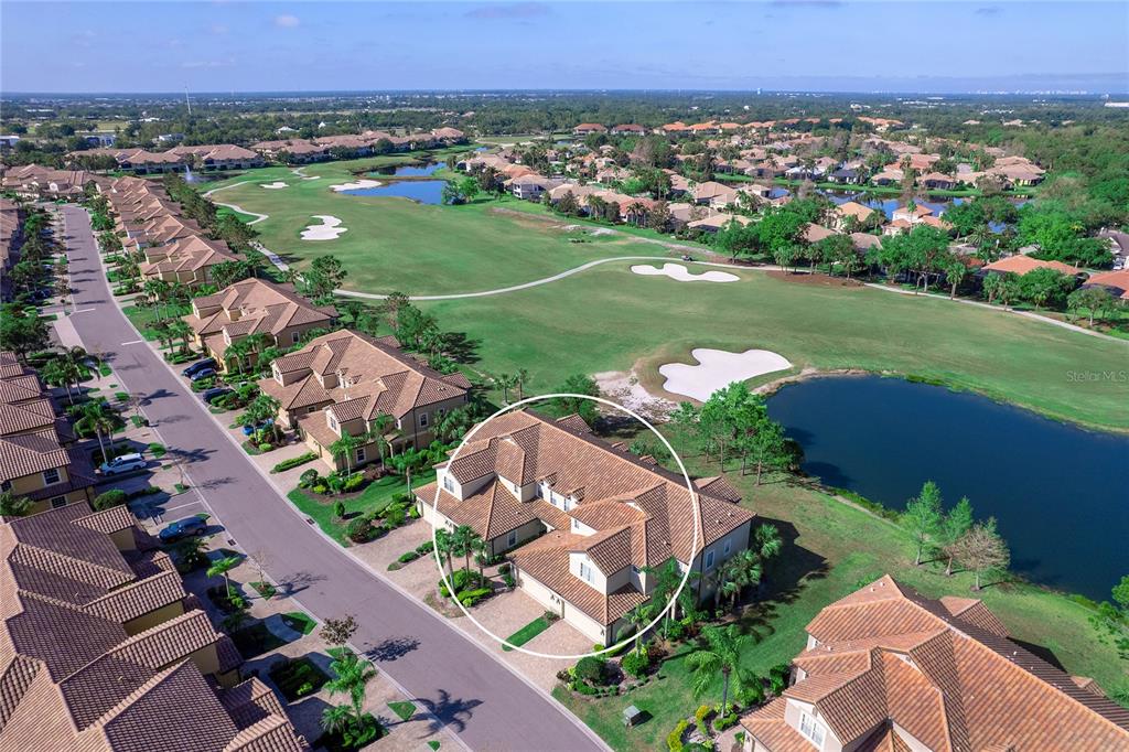 8142 Miramar Way Lakewood Ranch, FL 34202 - Photo 44 of 45 an aerial view of a city with lots of residential buildings and mountain view in back