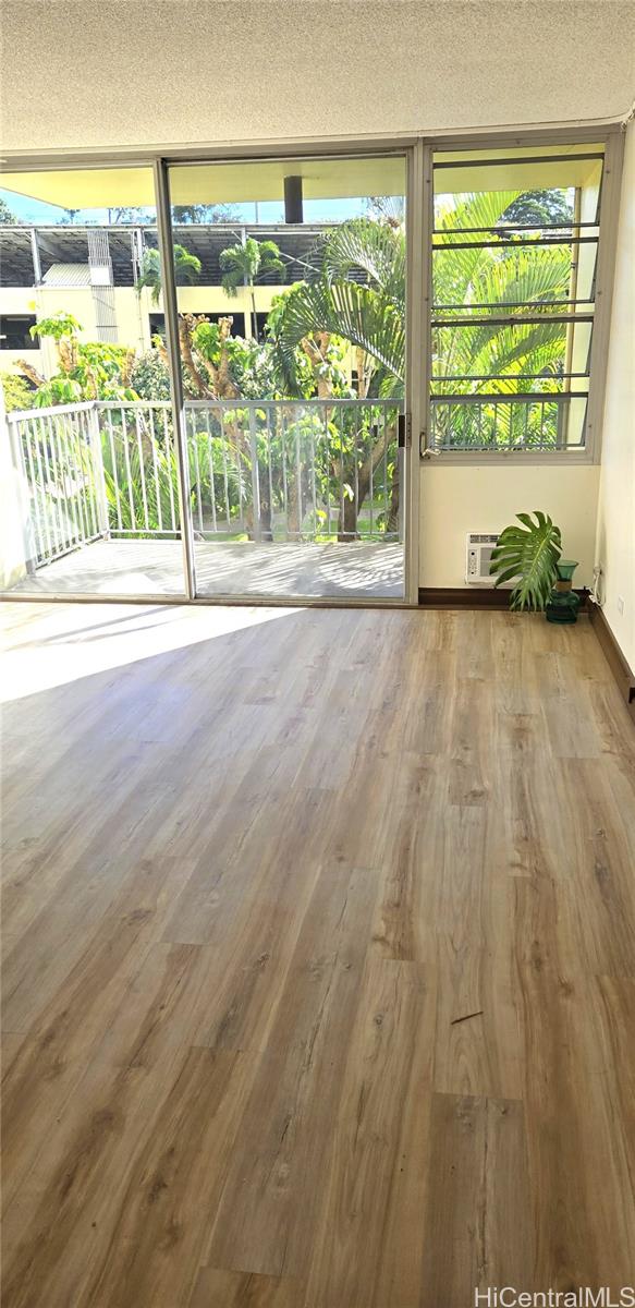 3161 Ala Ilima Street, Unit 309 Honolulu, HI 96818 - Photo 2 of 13 en empty room with large windows