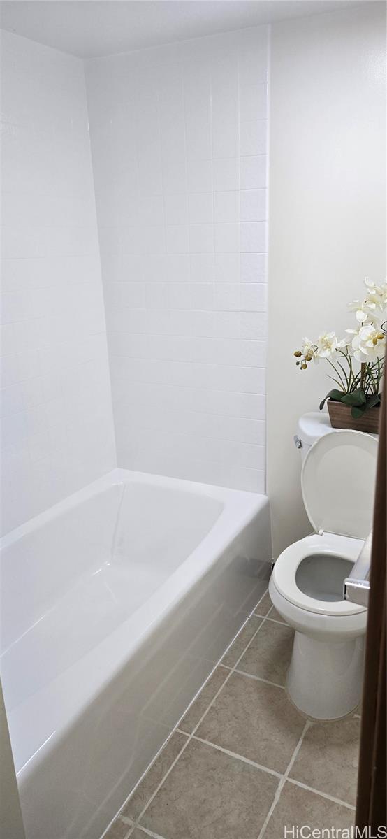 3161 Ala Ilima Street, Unit 309 Honolulu, HI 96818 - Photo 7 of 13 a white toilet sitting next to a bath tub