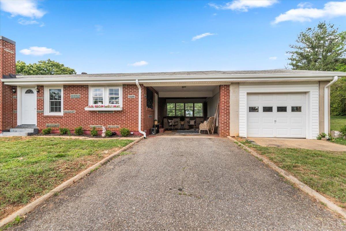3733 Depot Road Rustburg, VA 24588 - Photo 3 of 58 a view of a house with a yard and potted plants