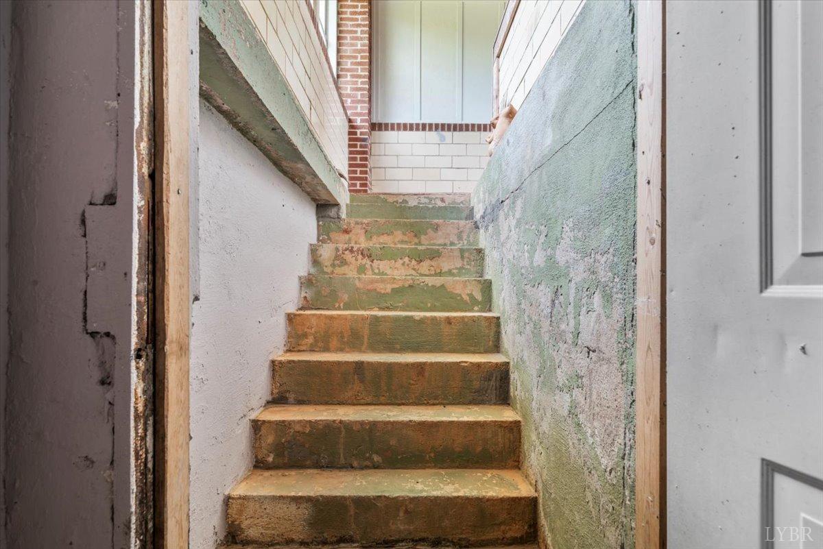 3733 Depot Road Rustburg, VA 24588 - Photo 49 of 58 a view of staircase with white walls and white door