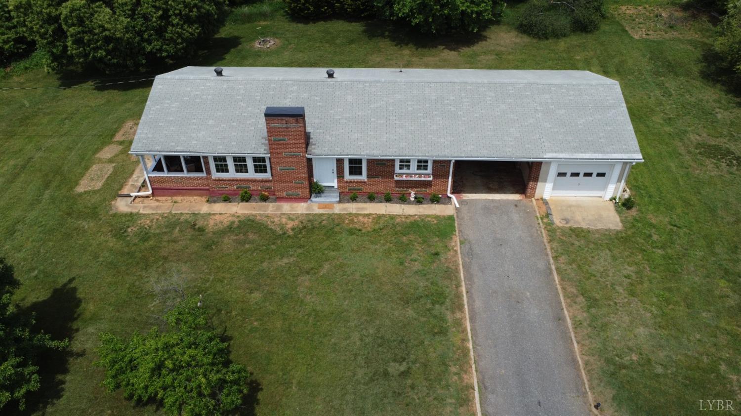 3733 Depot Road Rustburg, VA 24588 - Photo 54 of 58 an aerial view of a house with swimming pool and green space