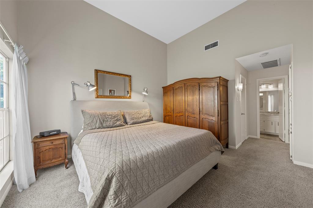 2901 Lake Shore Drive, Unit 405 Waco, TX 76708 - Photo 23 of 31 a bedroom with a bed and a mirror
