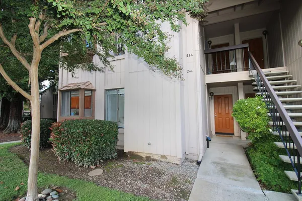 front view of a house with a small yard