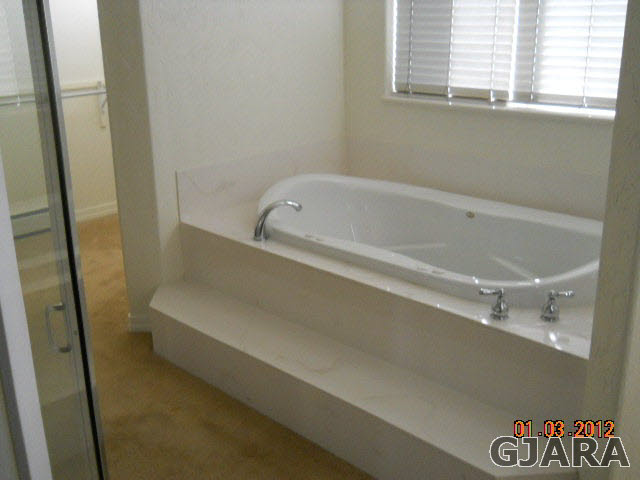 1634 M Road Fruita, CO 81521 - Photo 4 of 4 a bathroom with bathtub and a shower