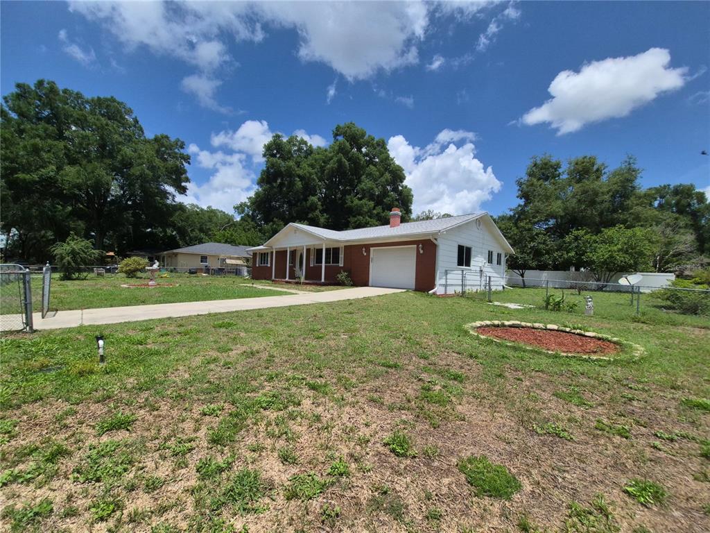 25632 Southwest 19 Avenue Newberry, FL 32669 - Photo 18 of 20 a front view of a house with garden