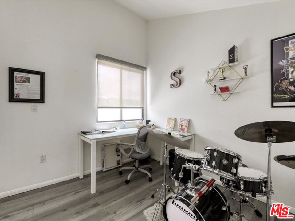 4477 Woodman Avenue, Unit 304 Sherman Oaks, CA 91423 - Photo 14 of 34 a view of a workspace with furniture and a window