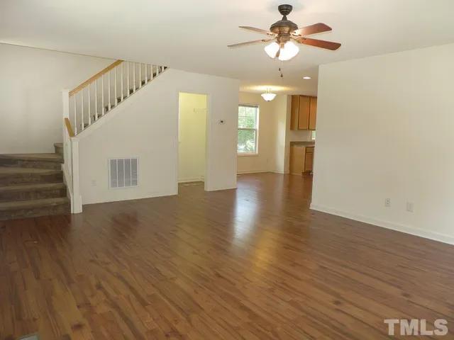 a view of an entryway with wooden floor