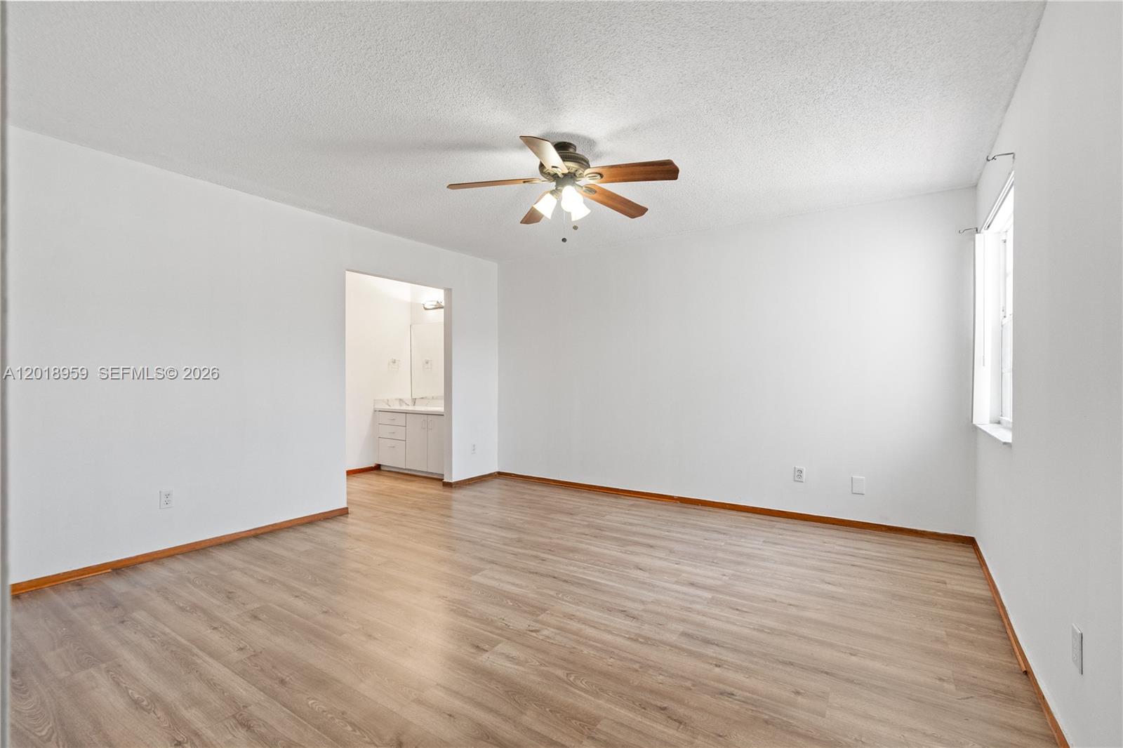 15345 Southwest 63rd Terrace Miami, FL 33193 - Photo 18 of 51 wooden floor in an empty room