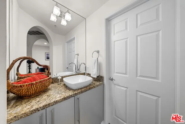 a bathroom with 2 sink and a mirror